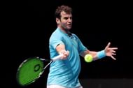 Malek Jaziri hits a forehand